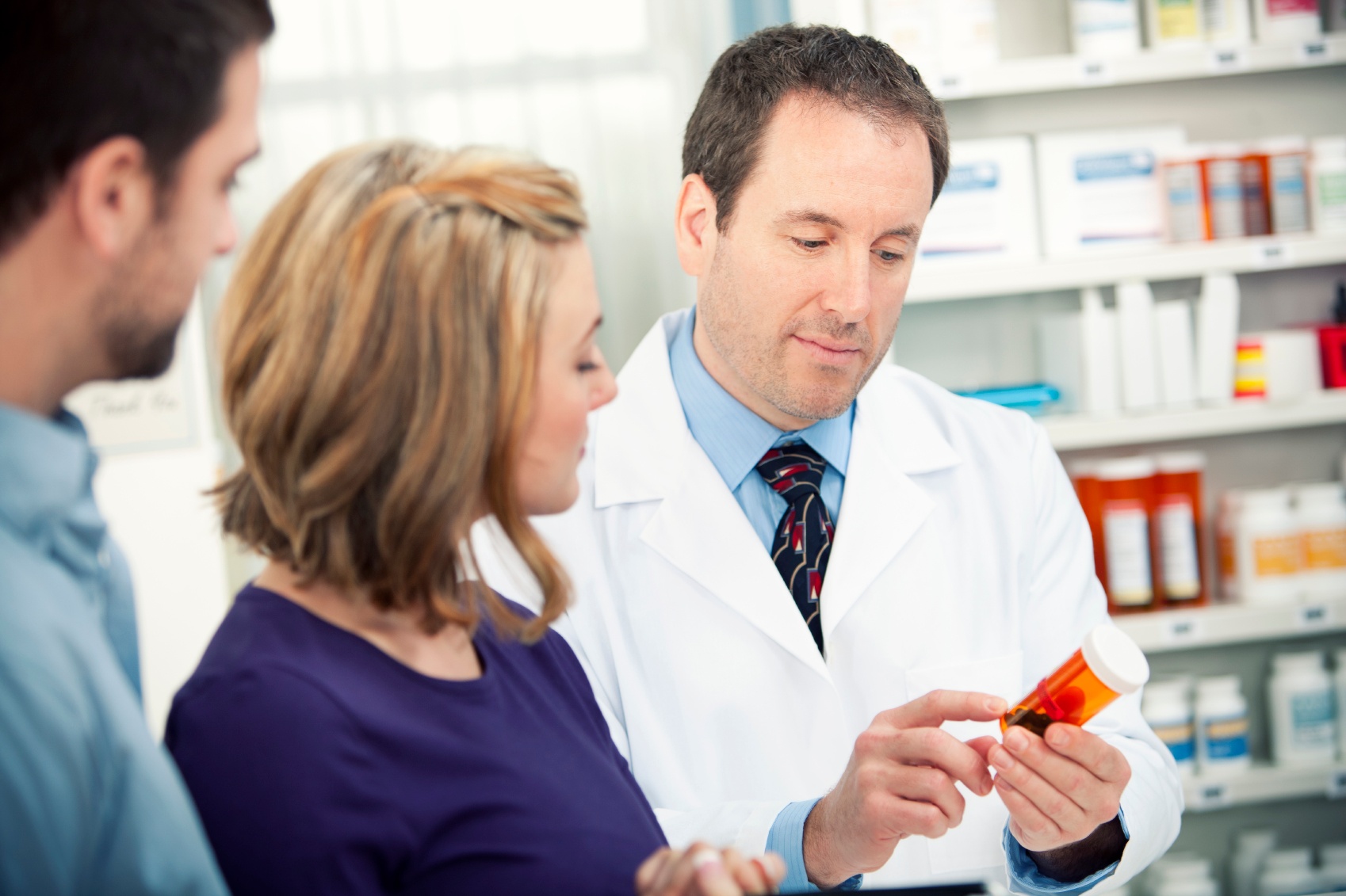 Pharmacist consulting with patient